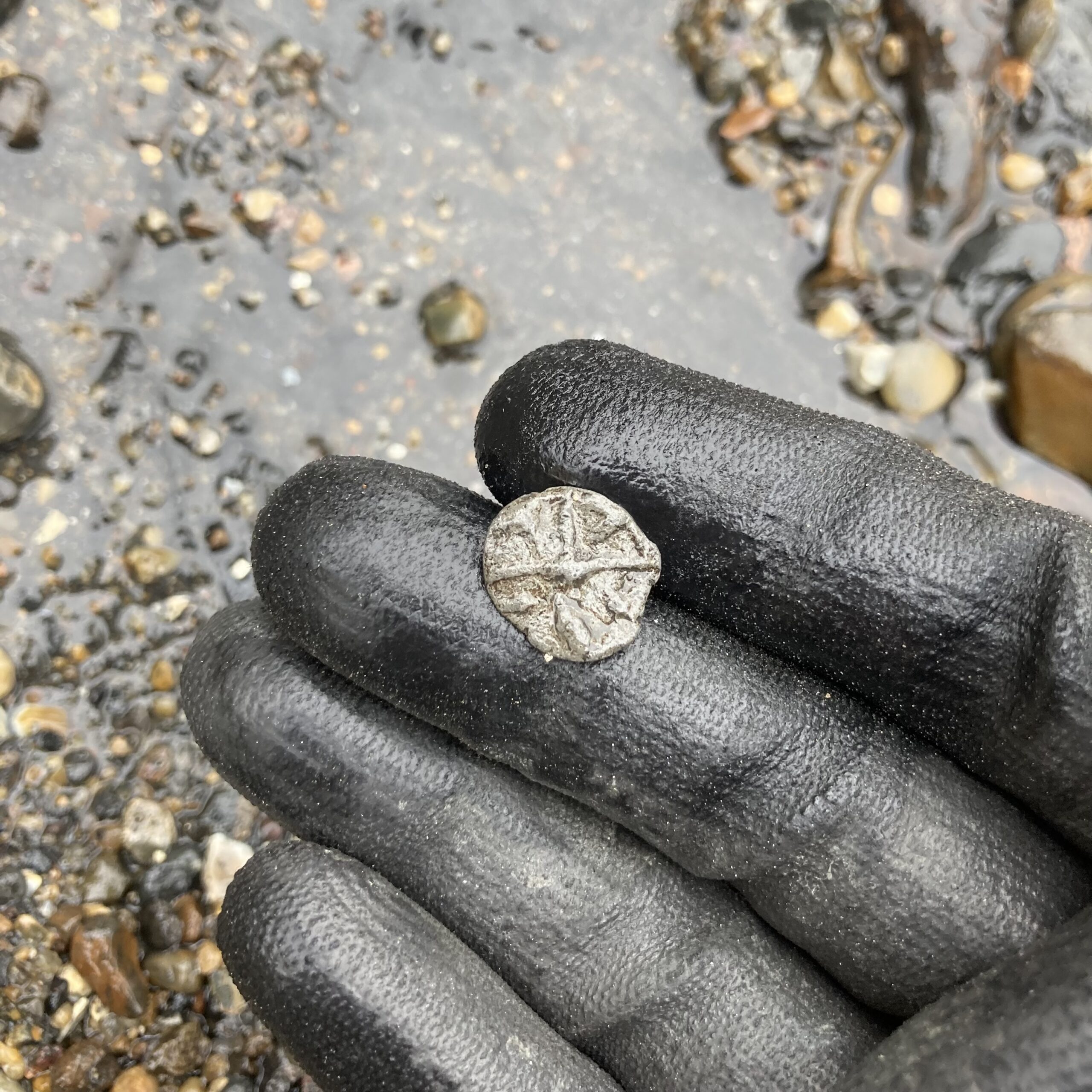 Lead token with cartwheel design
