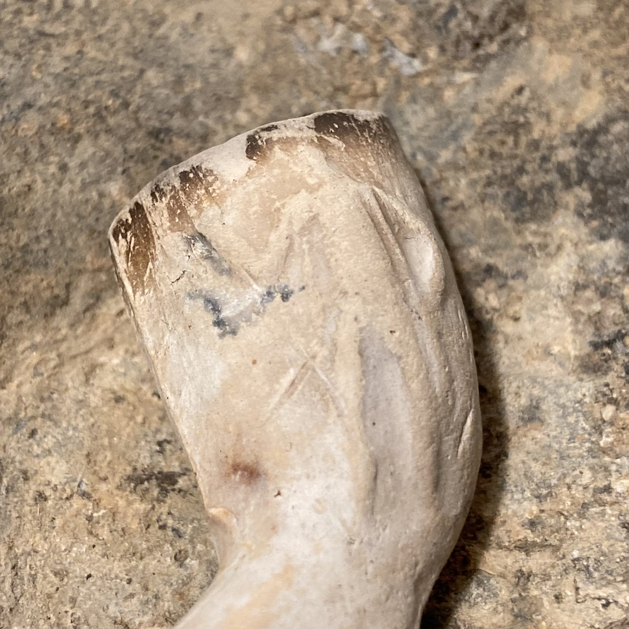 Clay tobacco pipe with figures of smoker and Indigenous American