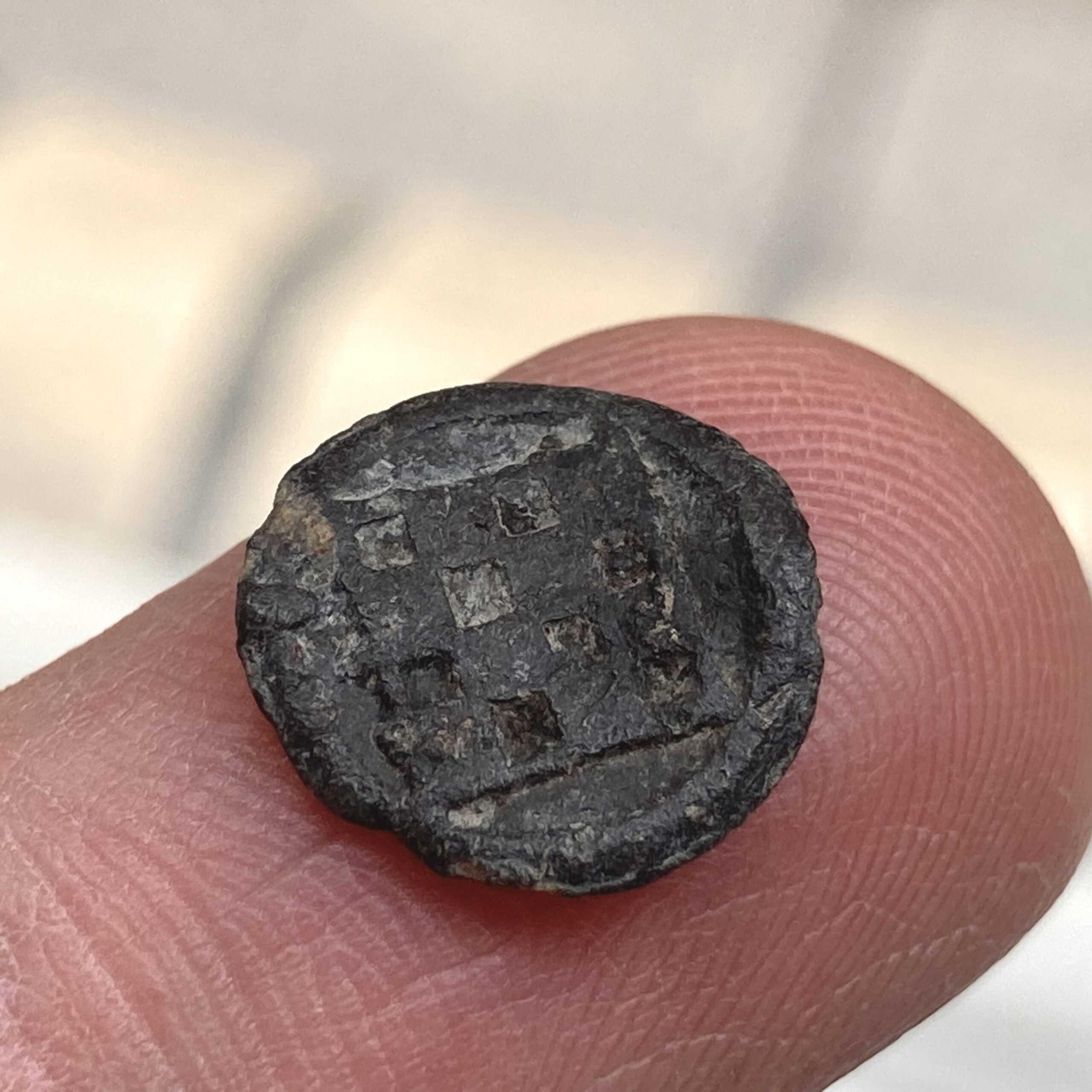 Lead token with checkerboard design