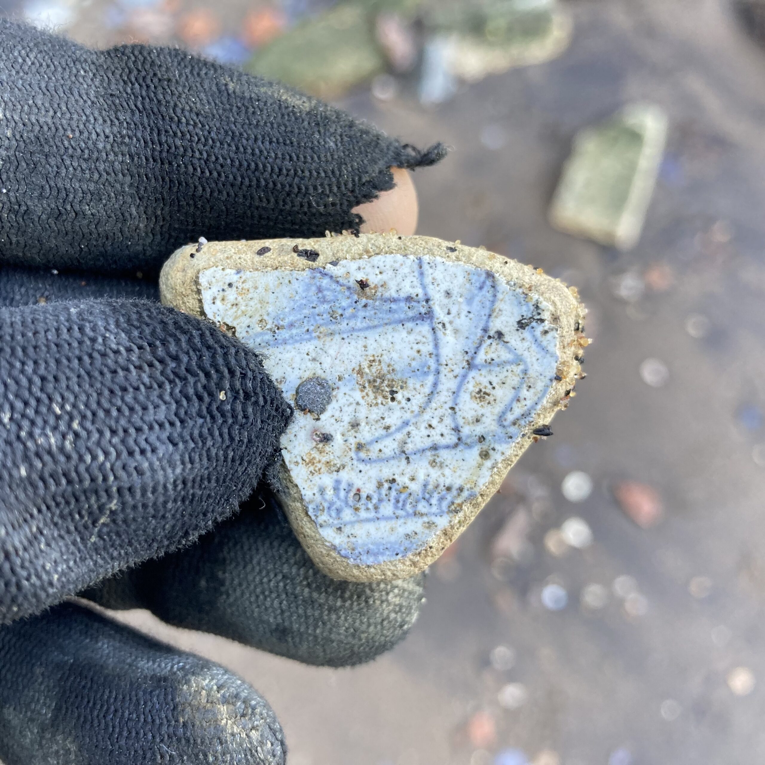 Sherd of tin-glazed Delftware tile depicting bare feet